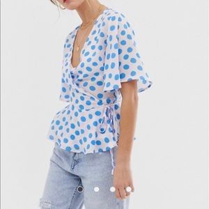 Wrap blouse with blue polka dots